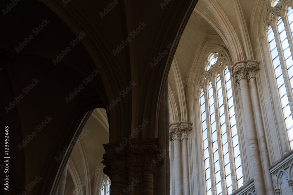 Windows with columns silhouette in a neo-Gothic cathedral in La