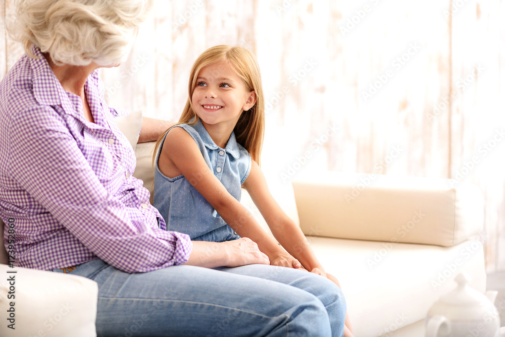 Cute child visiting granny at home Cute child visiting granny at home