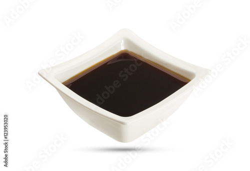 Soy sauce in bowl isolated, shoyu closeup in dish
