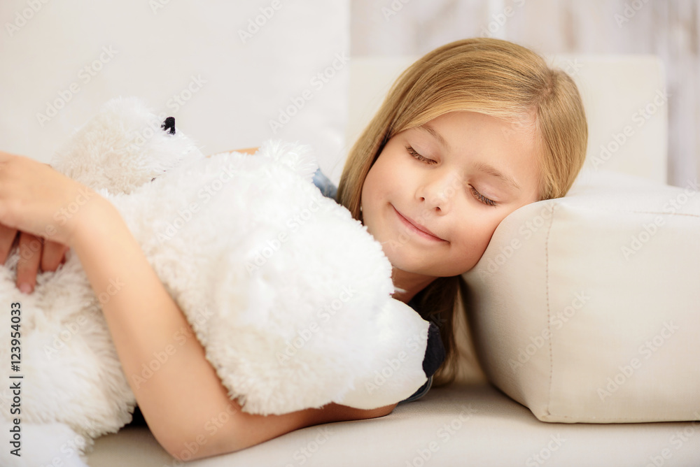 Carefree kid sleeping with bear toy Carefree kid sleeping with bear toy