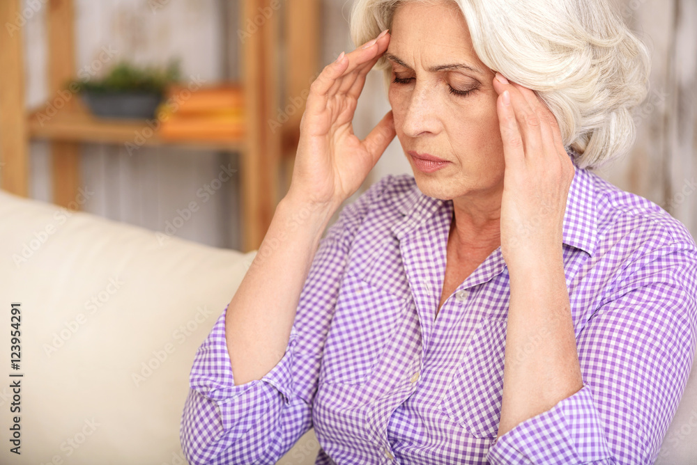 Old woman has terrible headache Old woman has terrible headache