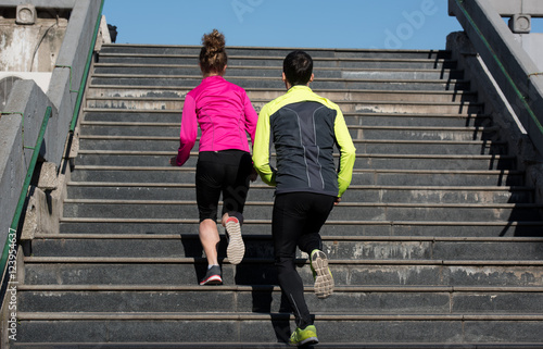 young couple jogging on steps