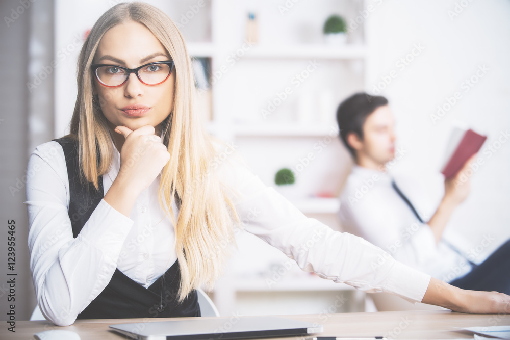 Female sitting at office desk