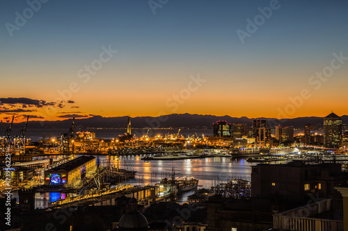 GENOA, ITALY, JANUARY 15, 2016: Sunset view of the city of Genoa, Italy/ Genoa landscape/ Genoa Skyline/ city landscape/ aereal view/ light/ city light/ orange/ sunshine