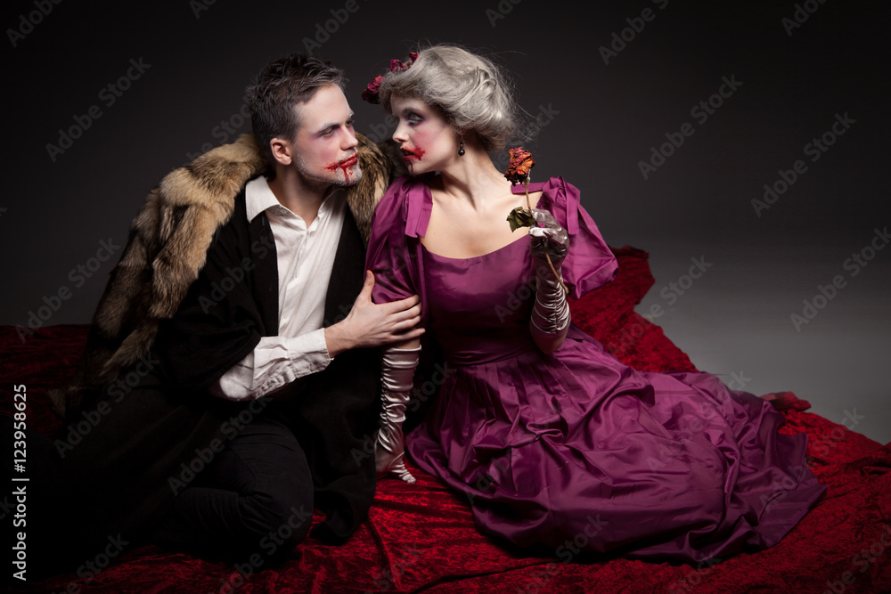 Fototapeta Beautiful vampires couple woman and man in medieval clothes