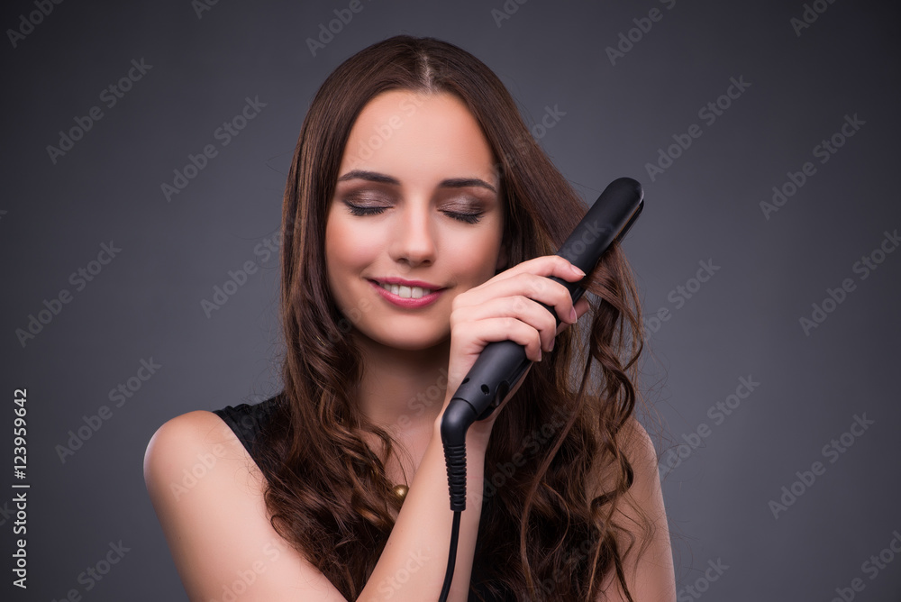Beautiful woman applying make-up in fashion concept 