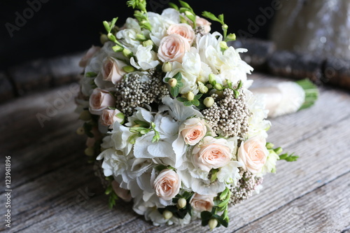 Bouquet of roses on wooden table. Close up