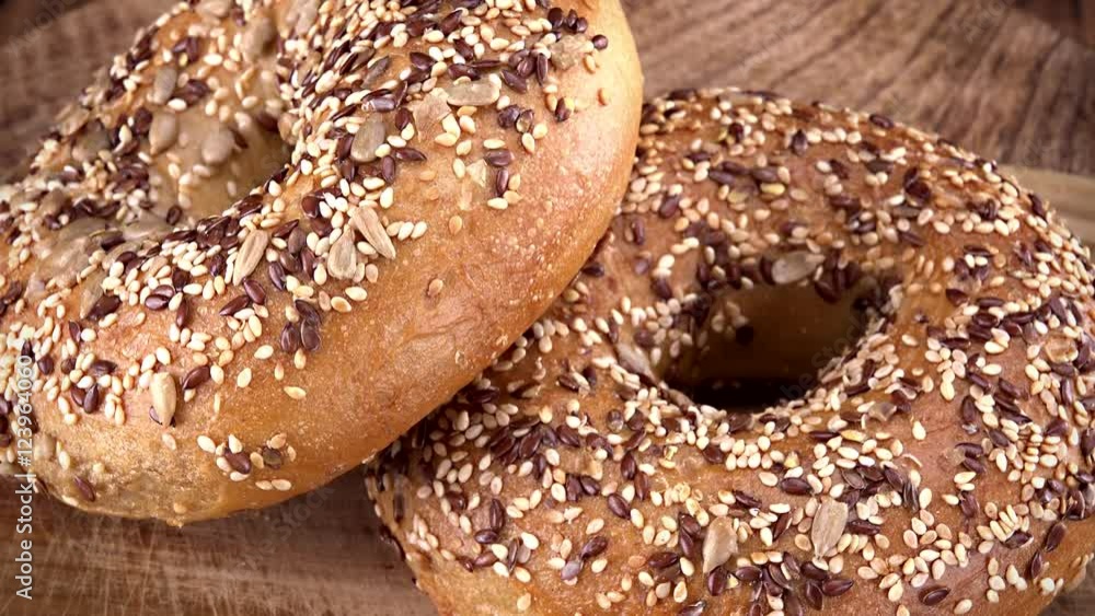 Portion of rotating Wholemeal Bagels (seamless loopable) as 4K UHD footage Portion of rotating Wholemeal Bagels (seamless loopable) as 4K UHD footage