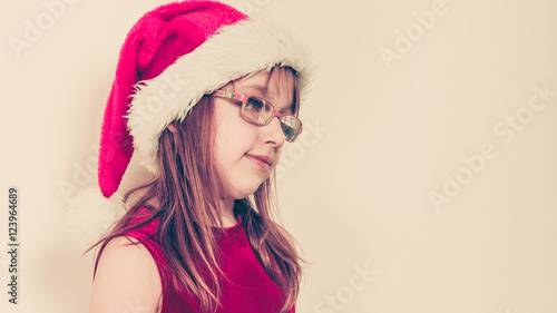 Little girl looking like santa elf. © Voyagerix