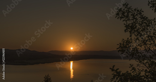 Sunset near Milada lake in summer evening