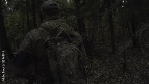 Wallpaper Mural Soldier with a gun in his hand goes through the dark forest Torontodigital.ca