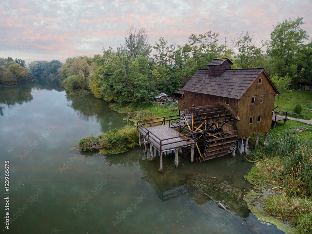Historical watermill on Small Danube near the village Jelka, Slovakia at dusk