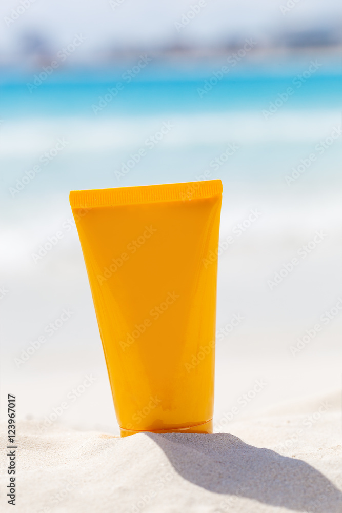 Sunscreen protection cream on beach
