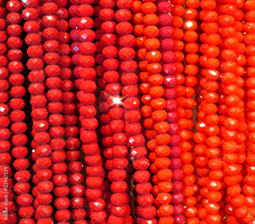 necklaces of shiny red beads for sale in shop