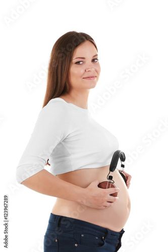 Pregnant woman holding head...