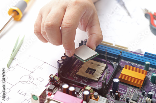 Man installing microprocess...