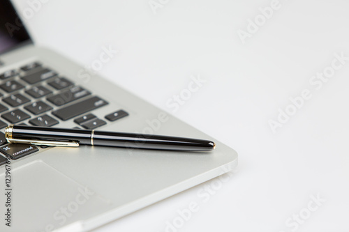 laptop with pen closeup