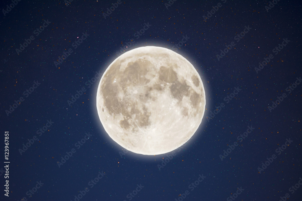 Iridescent glow of full moon in the night starry sky Iridescent glow of full moon in the night starry sky