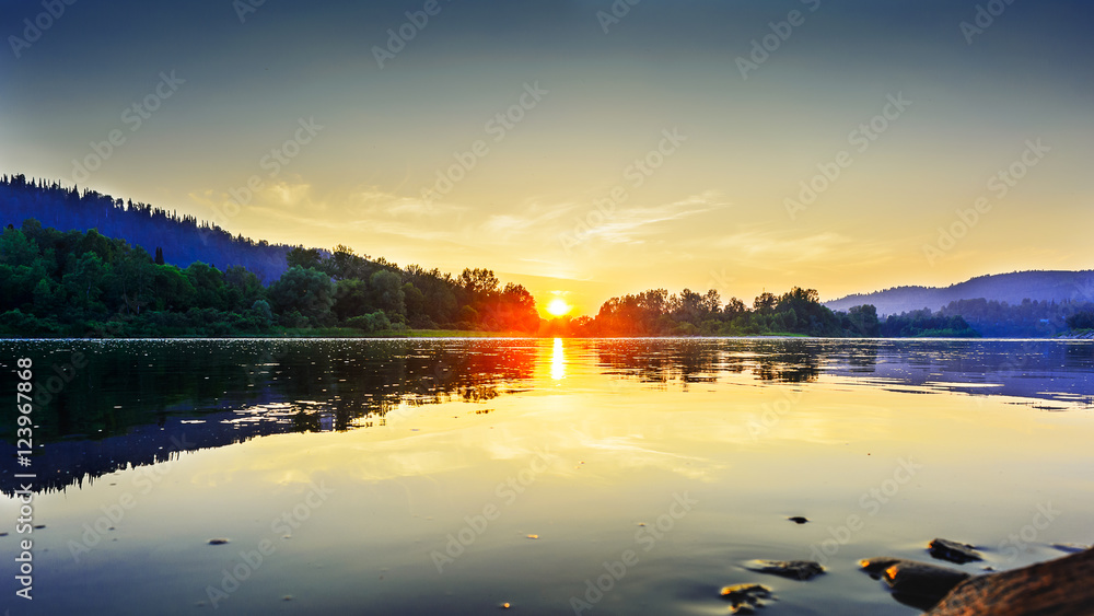 Fototapeta premium Summer sunset over idyllic river landscape