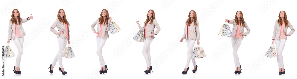 Young woman with shopping bags isolated on white Young woman with shopping bags isolated on white