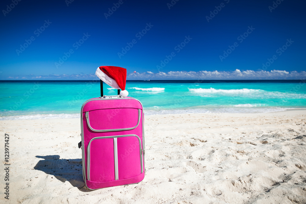 Santa hat on baggage, Christmas vacation Santa hat on baggage, Christmas vacation