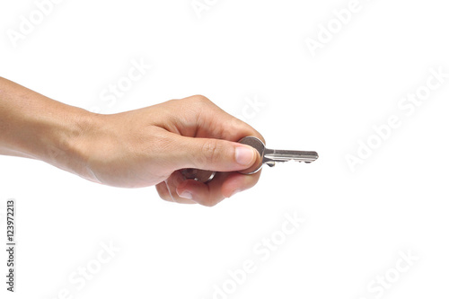 Hand holding key isolated