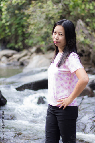 Thai woman with Mae Ya waterfall, Chiangmai Thailand photo