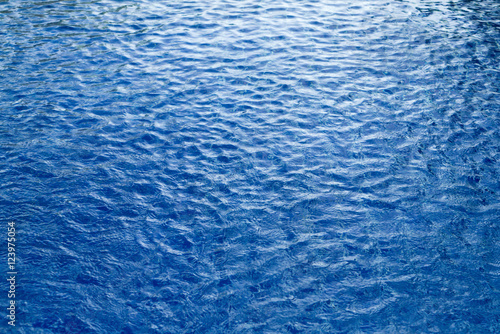 Surface waves are used for a dark blue background.