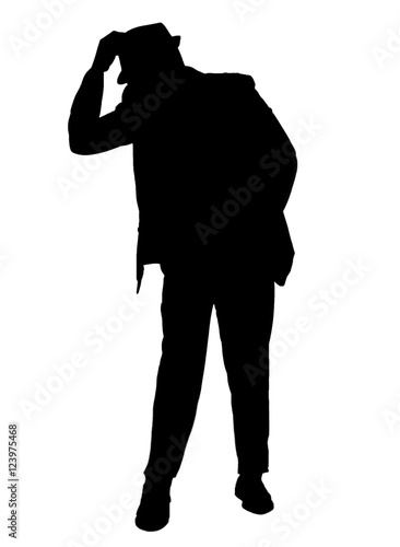 Canvas-taulu Silhouetted of a man dressed in a suit tipping his hat isolated on 

white
