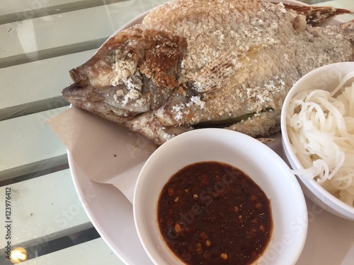 Tilapia grilled on white dish