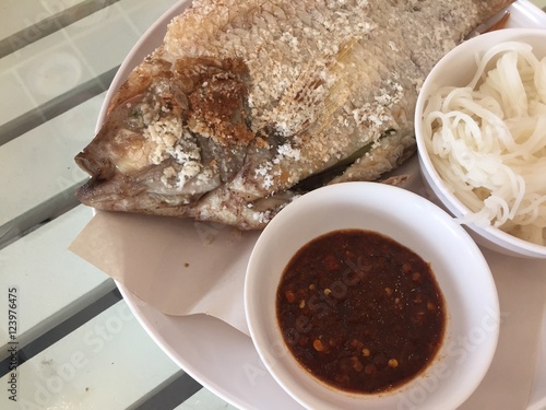 Tilapia grilled on white dish