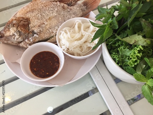 Tilapia grilled on white dish