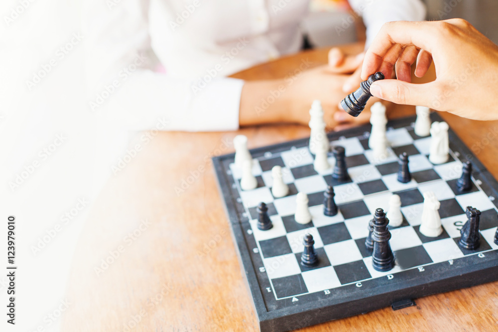 soft focus shot of businesspeople playing chess in office soft focus shot of businesspeople playing chess in office