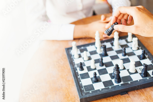 soft focus shot of businesspeople playing chess in office