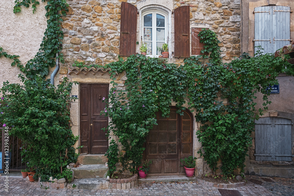 The facade of an old house in the French village Vallon Pont d'Arc.