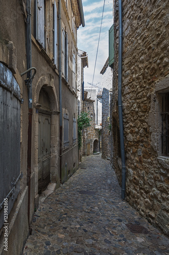 Narrow street in the small French village Vallon Pont d Arc.
