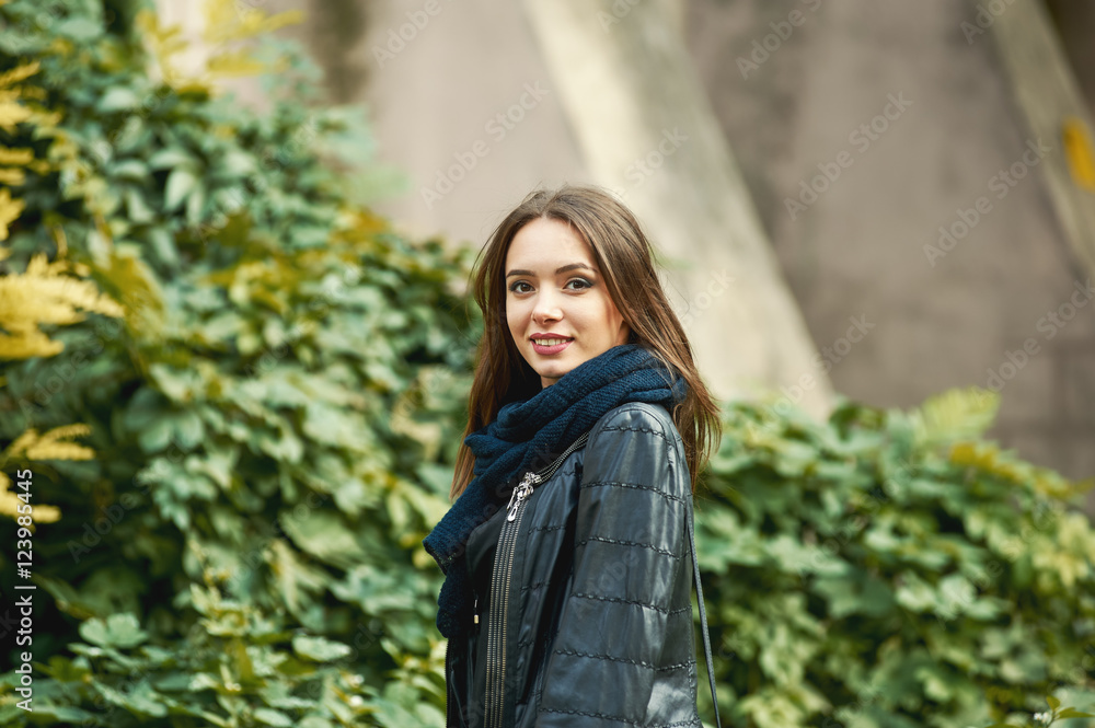 Outdoor portrait of young beautiful girl in town . Outdoor portrait of young beautiful girl in town .