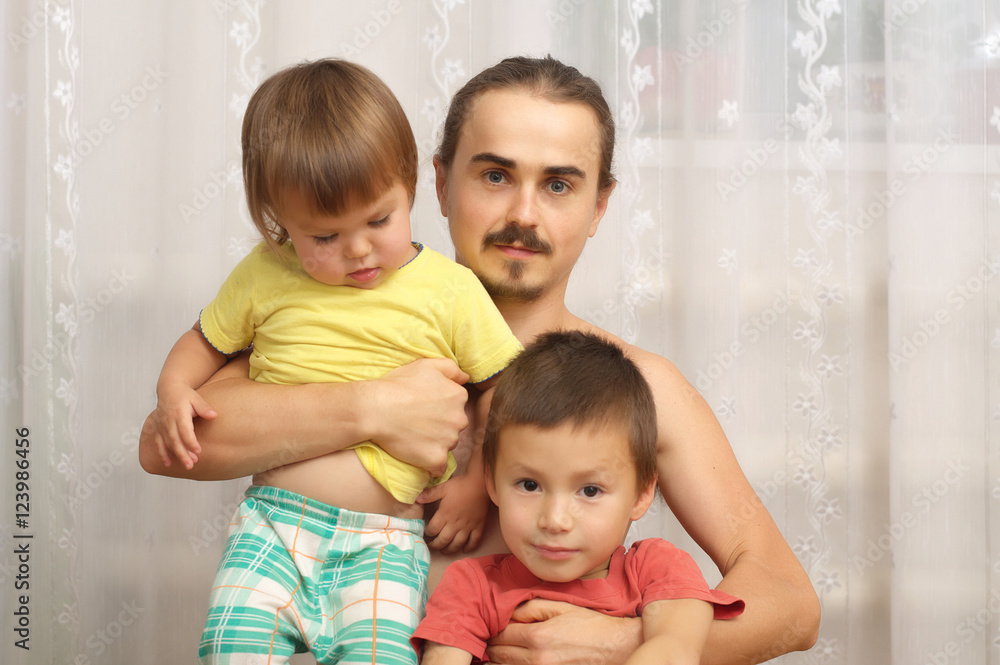 Happy father with two playful kids - daughter and son Happy father with two playful kids - daughter and son