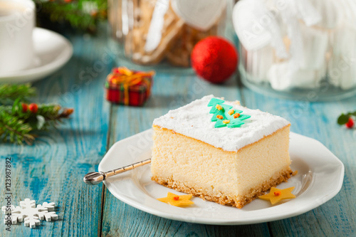 Delicious, traditional cheesecake. Christmas decoration.