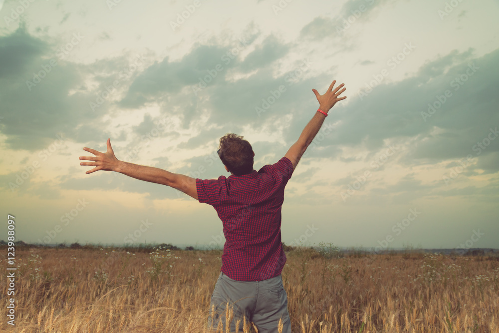 Man enjoying in nature. Wheat field.
Man enjoying in nature. Wheat field.