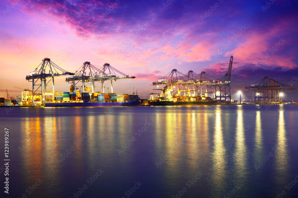 Fototapeta premium Containers loading by crane in the evening trade port shipping, Shipping and logistic concept