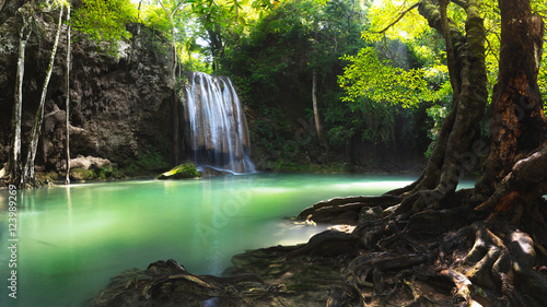 Beautiful waterfall with sunlight  Nature landscape  Useful for waterfall background  Erawan waterfall  Thailand