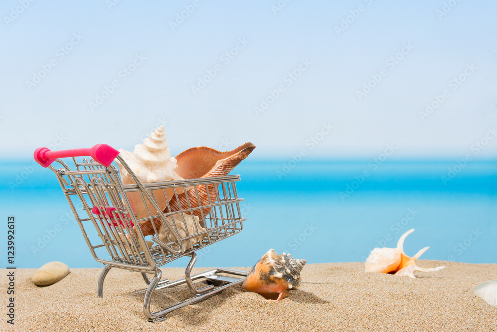 Summer signings, shopping travel. Cart on the beach Summer signings, shopping travel. Cart on the beach