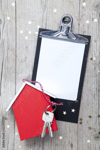 Photography Creative Christmas Background with a key and a new house