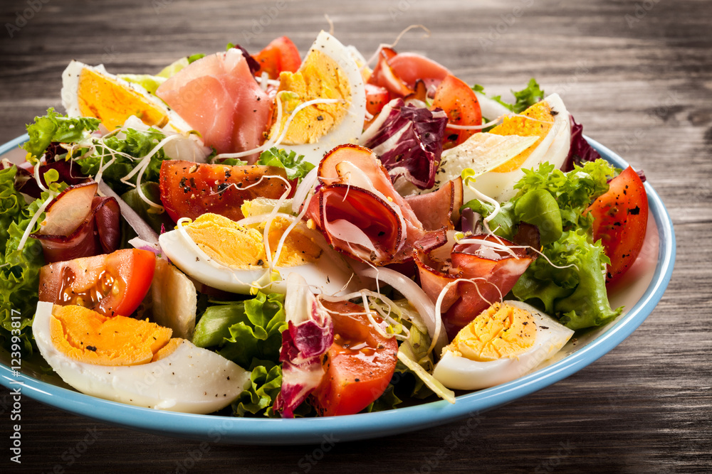 Boiled eggs with smoked ham and vegetables Boiled eggs with smoked ham and vegetables