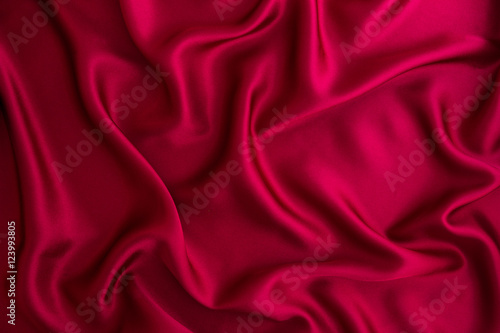 Close up wave red silk or satin fabric background