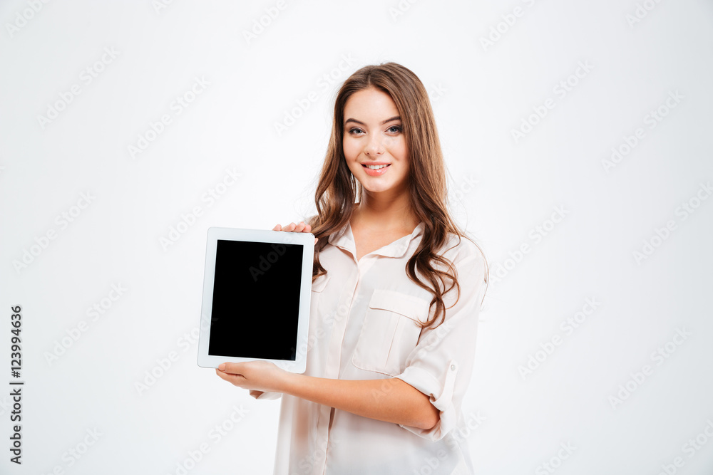 Happy young woman showing blank tablet computer screen Happy young woman showing blank tablet computer screen