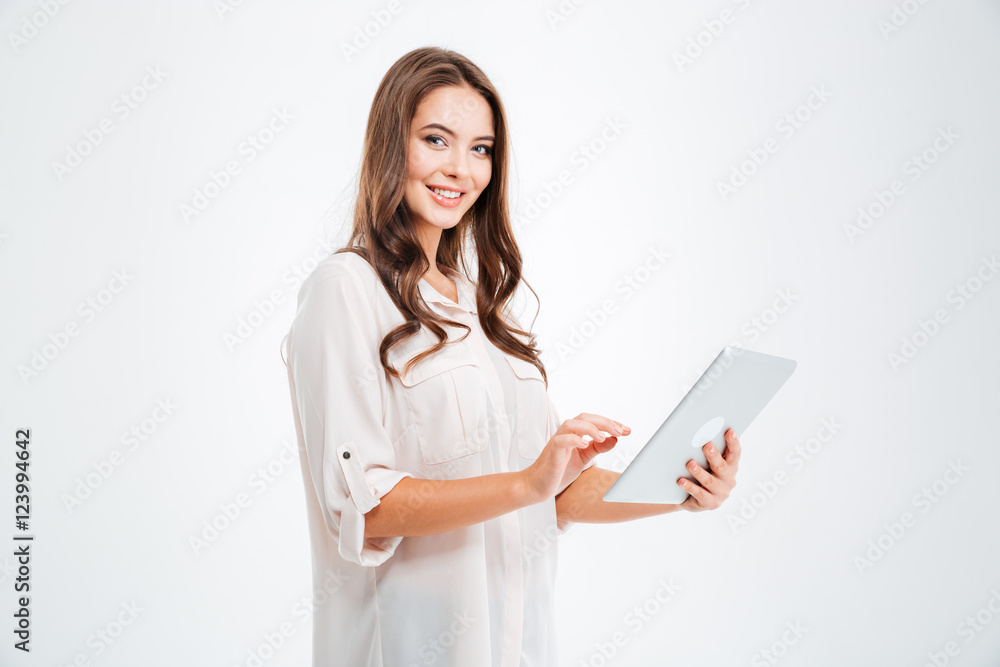 Portrait of a happy brunette woman using tablet computer Portrait of a happy brunette woman using tablet computer