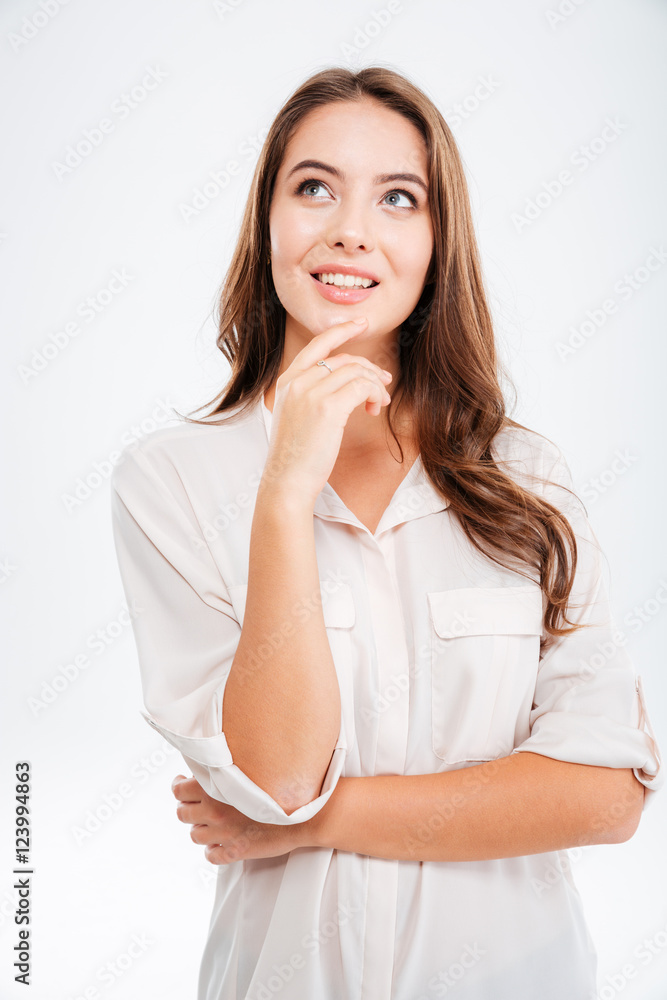 Portrait of a pensive thoughtful pretty girl thinking about something Portrait of a pensive thoughtful pretty girl thinking about something
