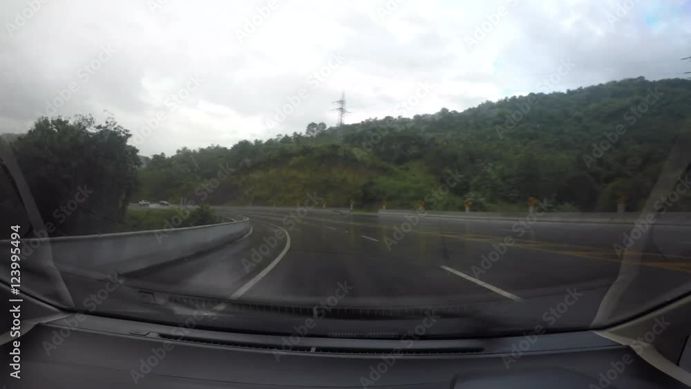 Driving a Car on a Country Road windshield. Day, with rain Driving a Car on a Country Road windshield. Day, with rain